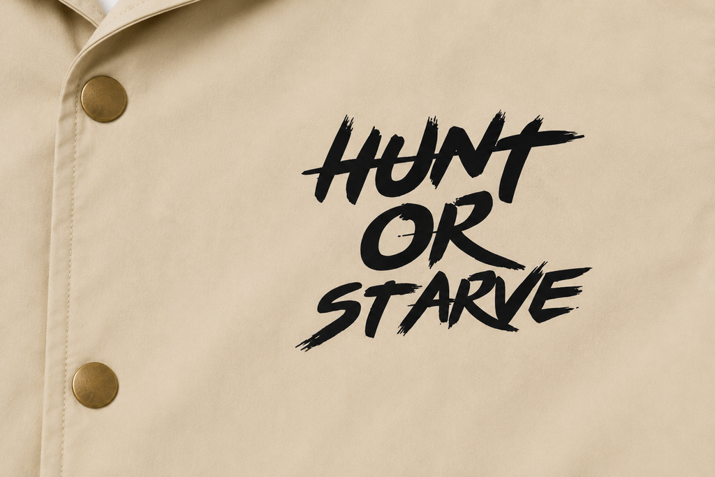 HUNT OR STARVE Coach Jacket close-up of branded chest graphic
