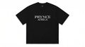 Black t-shirt with 'PRYNCE AFRICA' text on a white background